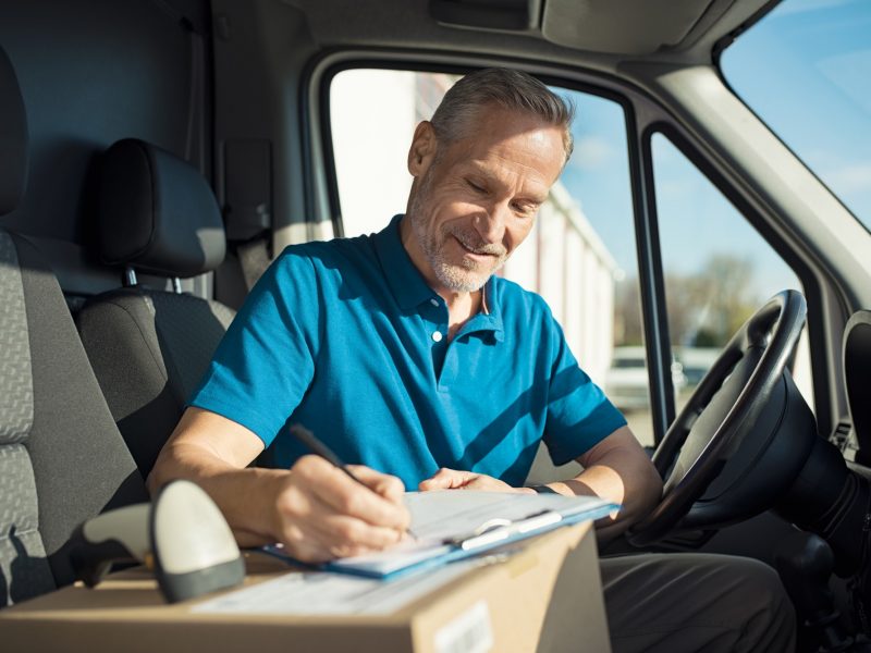 Courier signing delivery receipt